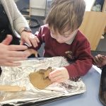 Student user mold cutter to cut dough.