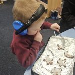 Student icing biscuits