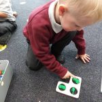Student working with objects.